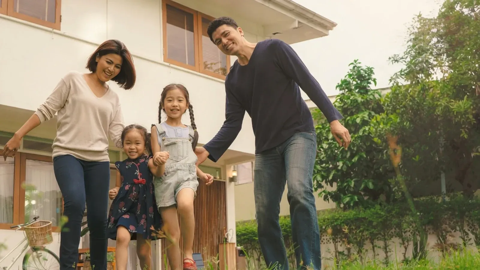 A growing family enjoying the yard of a home with room to move